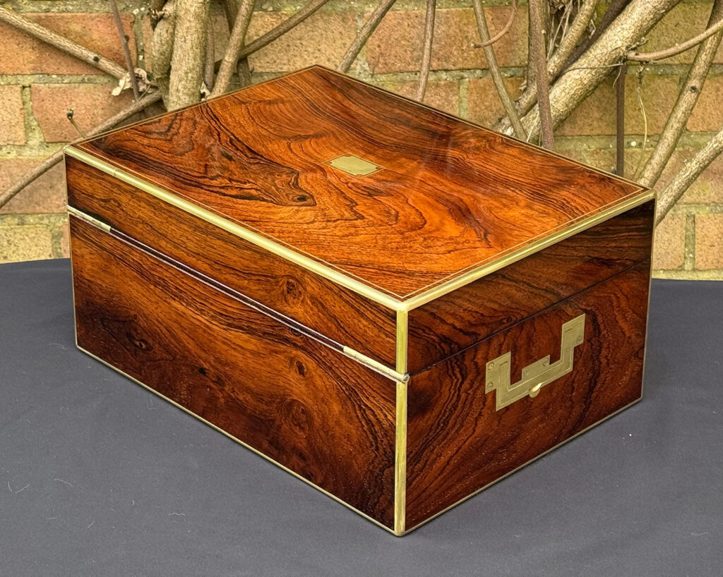 Rear left view of an antique jewellery box in rosewood, by Edwards.