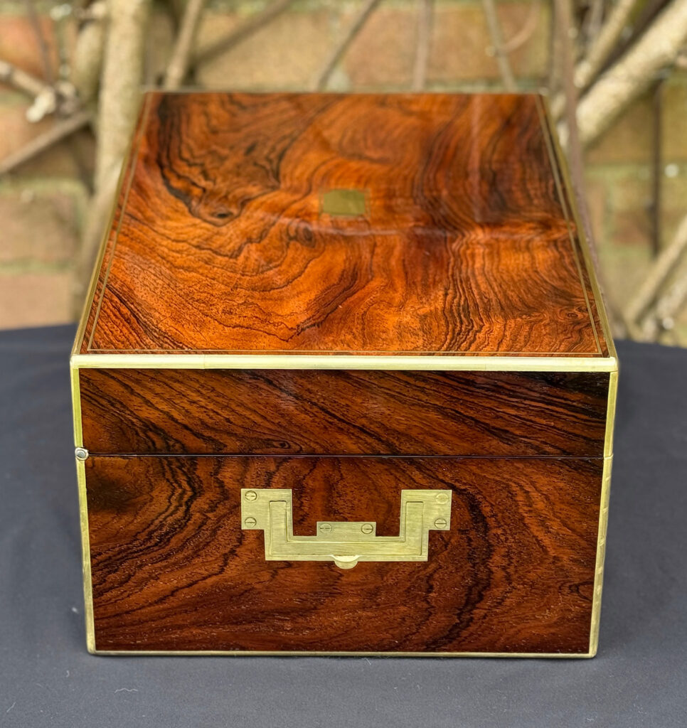 Left side view of an antique jewellery box in rosewood, by Edwards.