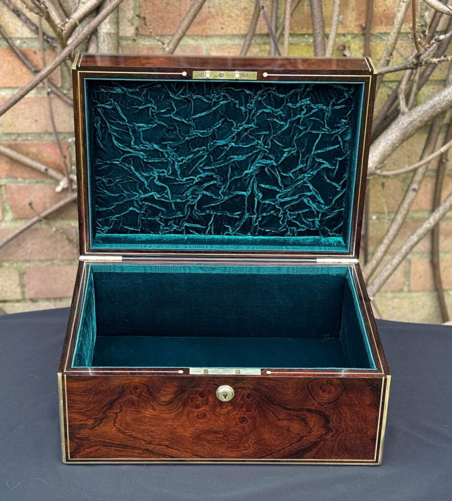 Front interior view of an antique jewellery box in rosewood, by Edwards.