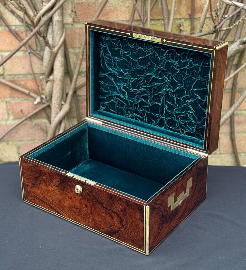 Front right interior view of an antique jewellery box in rosewood, by Edwards.