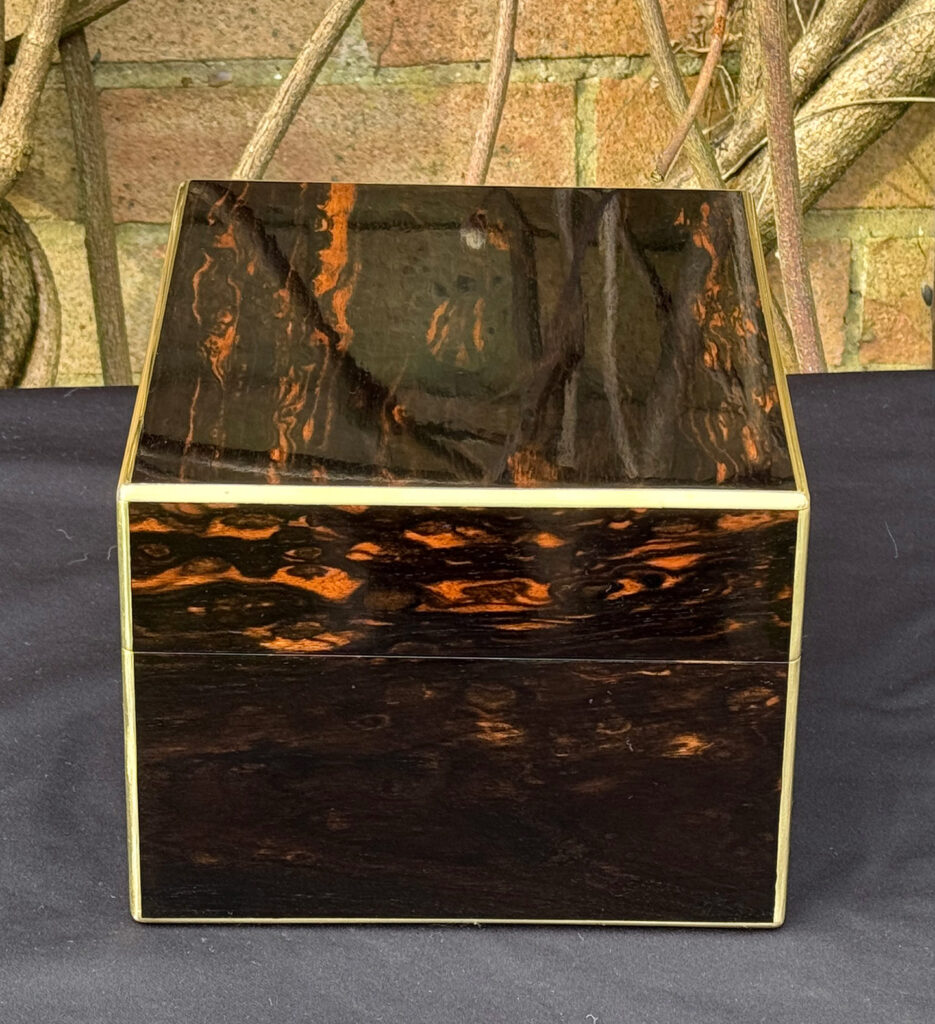 Right side view of a rare miniature antique jewellery box in coromandel, by George Betjemann & Sons.
