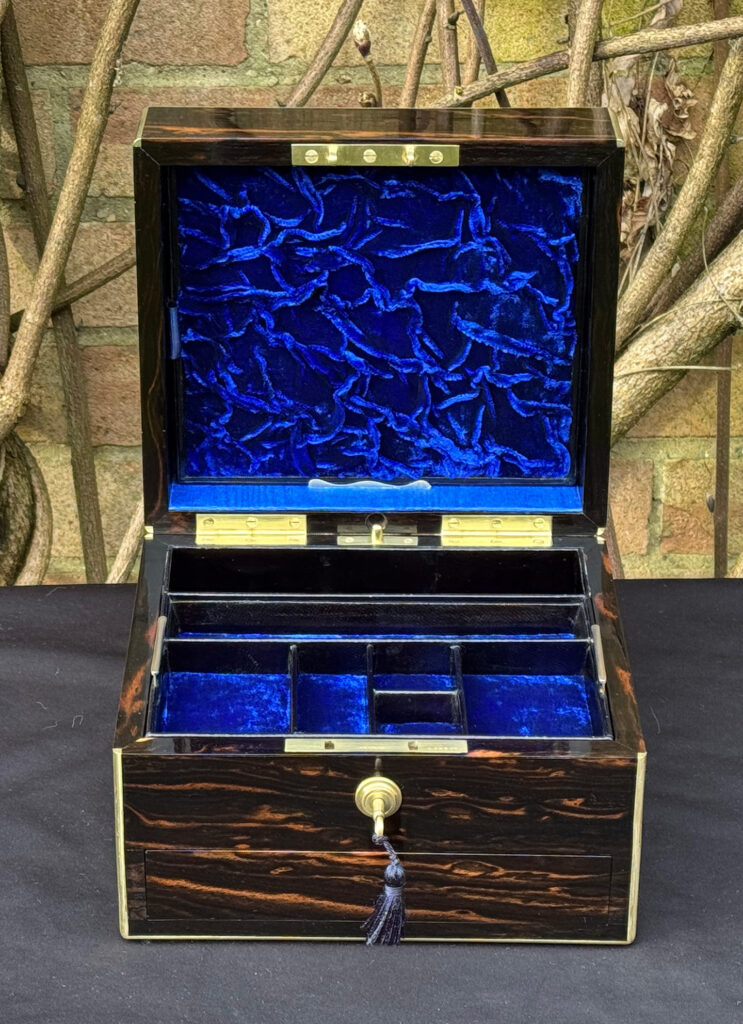 Front interior view of a rare miniature antique jewellery box in coromandel, by George Betjemann & Sons.