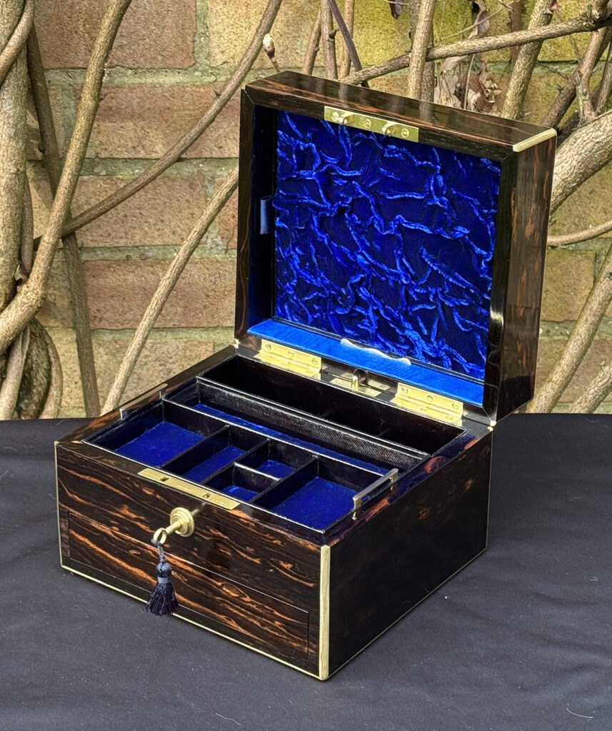 Front right interior view of a rare miniature antique jewellery box in coromandel, by George Betjemann & Sons.