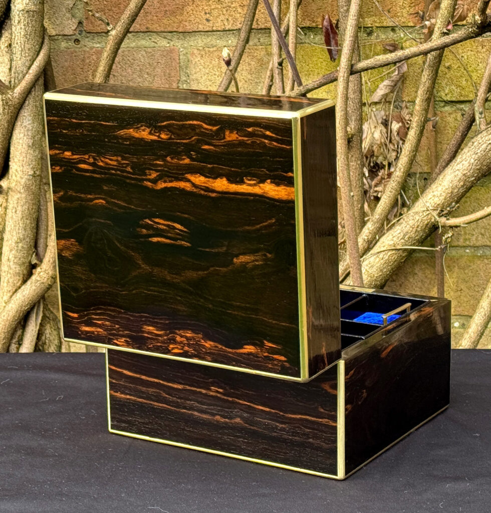 Rear opened view of a rare miniature antique jewellery box in coromandel, by George Betjemann & Sons.
