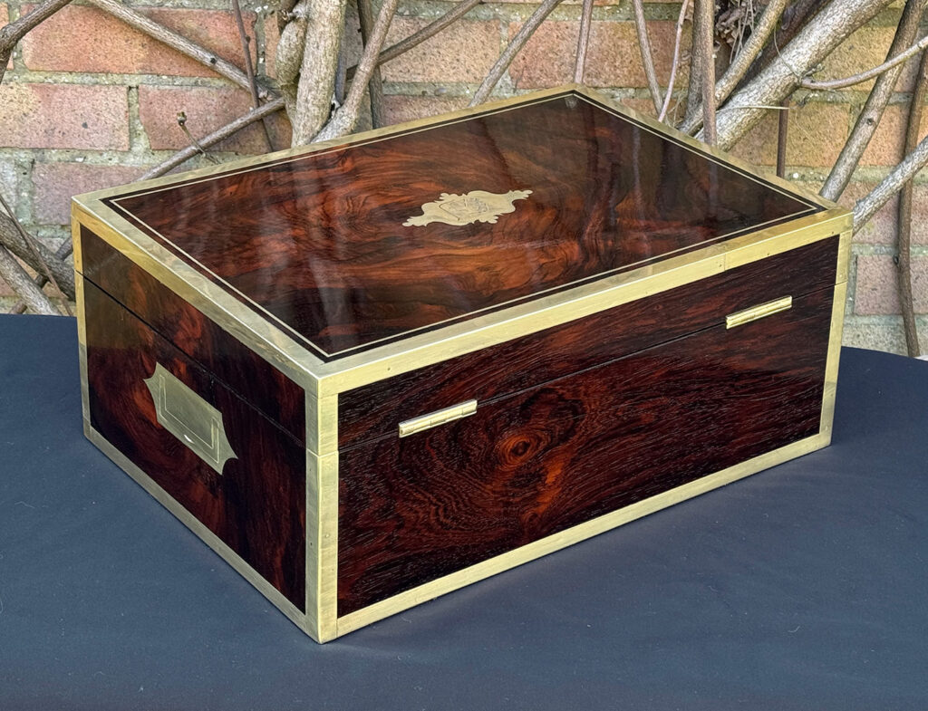 Rear right view of a large antique jewellery and writing Box in rosewood with naval heritage, attributed to Edwards.