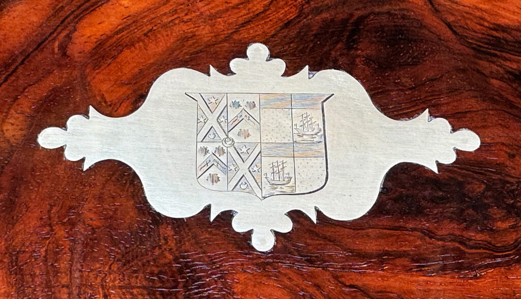 Heraldic crest from a large antique jewellery and writing Box in rosewood with naval heritage, attributed to Edwards.