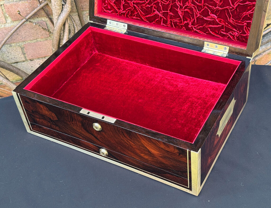 Closer interior view of a large antique jewellery and writing Box in rosewood with naval heritage, attributed to Edwards.