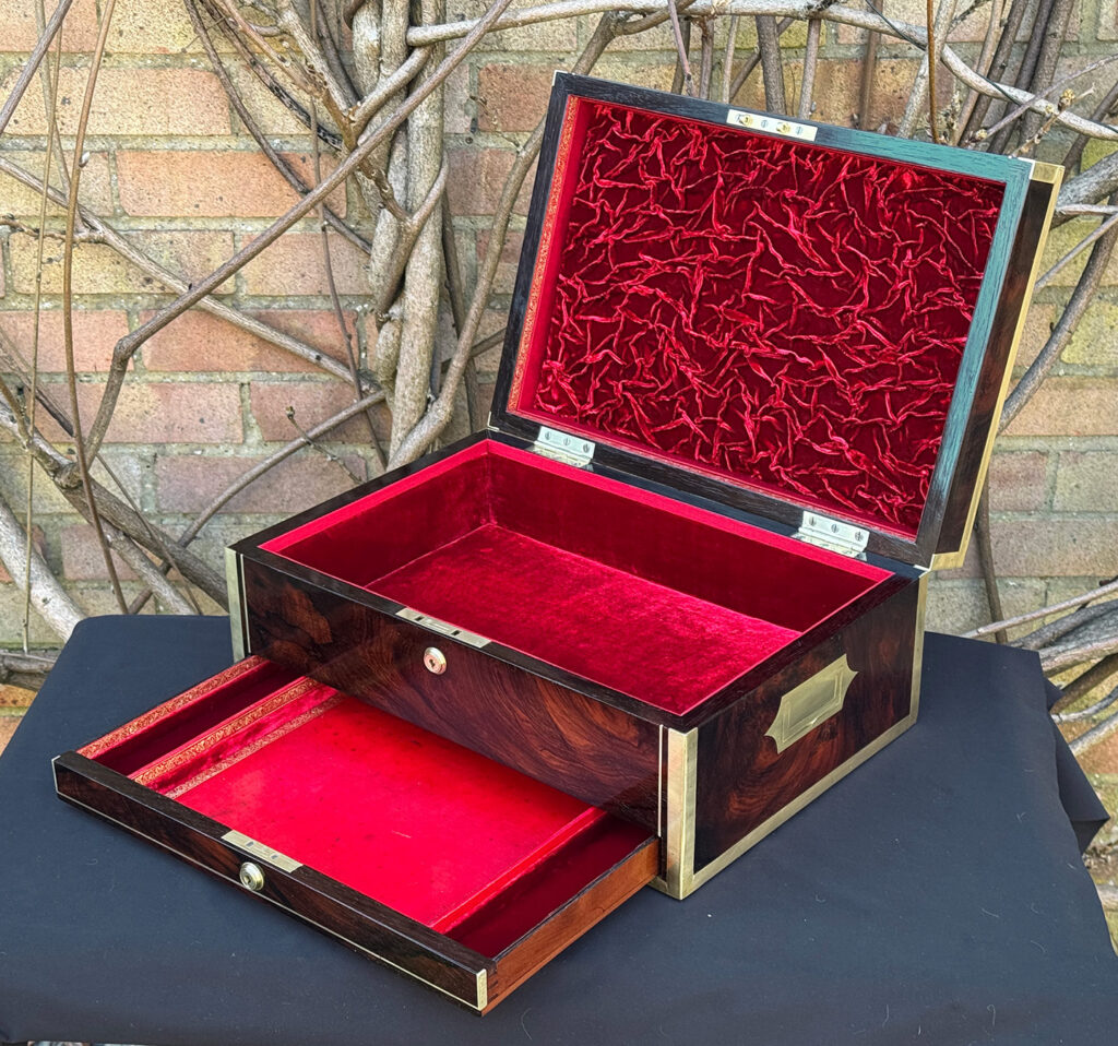 Front right interior view of a large antique jewellery and writing Box in rosewood with naval heritage, attributed to Edwards, with lower drawer opened further.