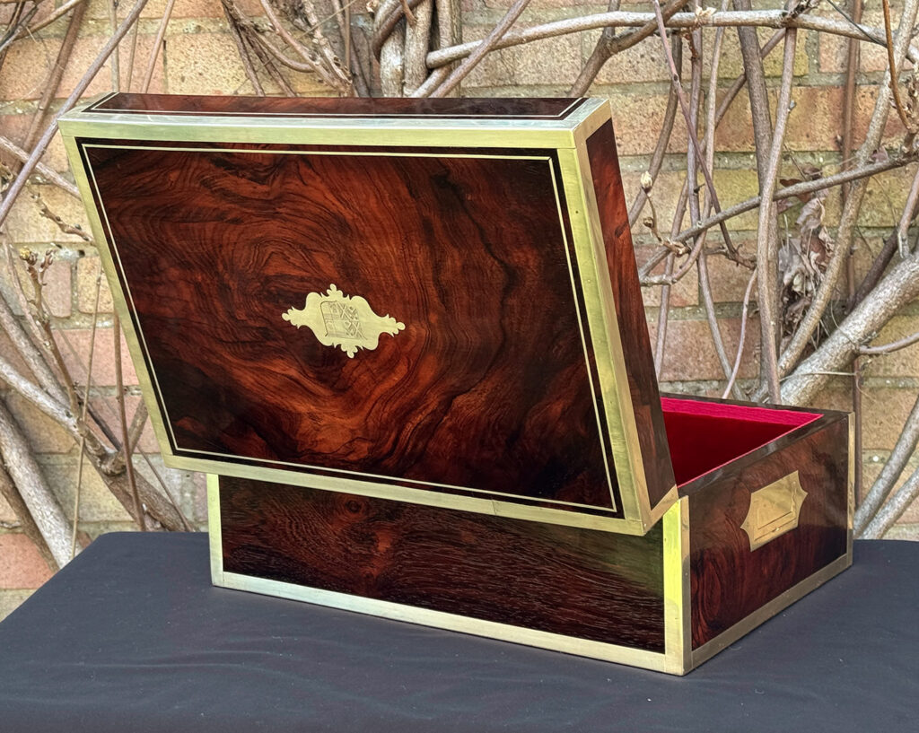 Rear opened view of a large antique jewellery and writing Box in rosewood with naval heritage, attributed to Edwards.