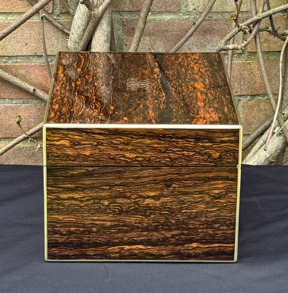 Right side view of an antique jewellery box in coromandel by Halstaff & Hannaford.