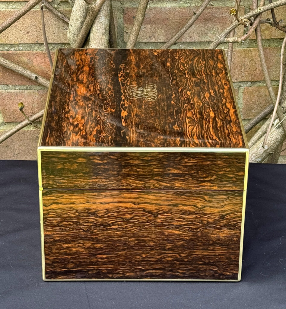 Left side view of an antique jewellery box in coromandel by Halstaff & Hannaford.