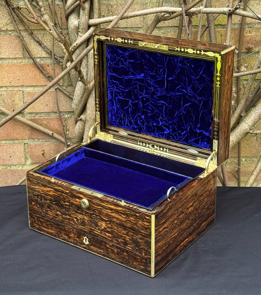 Front right interior view of an antique jewellery box in coromandel by Halstaff & Hannaford.