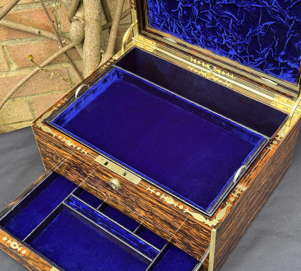 Closer interior view of an antique jewellery box in coromandel by Halstaff & Hannaford.