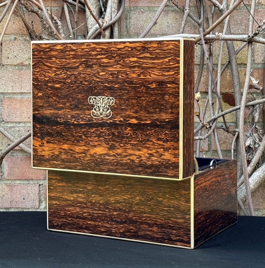 Rear opened view of an antique jewellery box in coromandel by Halstaff & Hannaford.