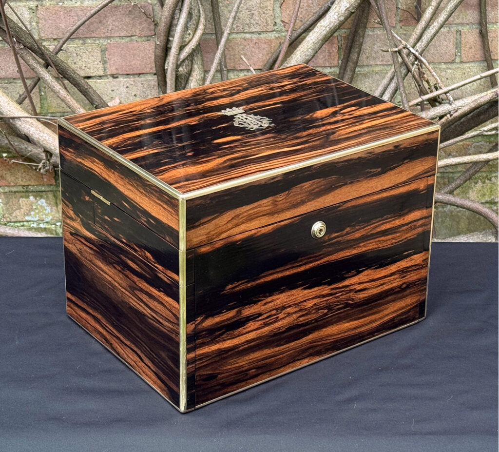 Front left view of an antique jewellery box in calamander - A wedding gift to the Duchess of St. Albans.