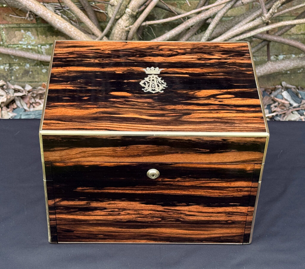 Overhead view of an antique jewellery box in calamander - A wedding gift to the Duchess of St. Albans.