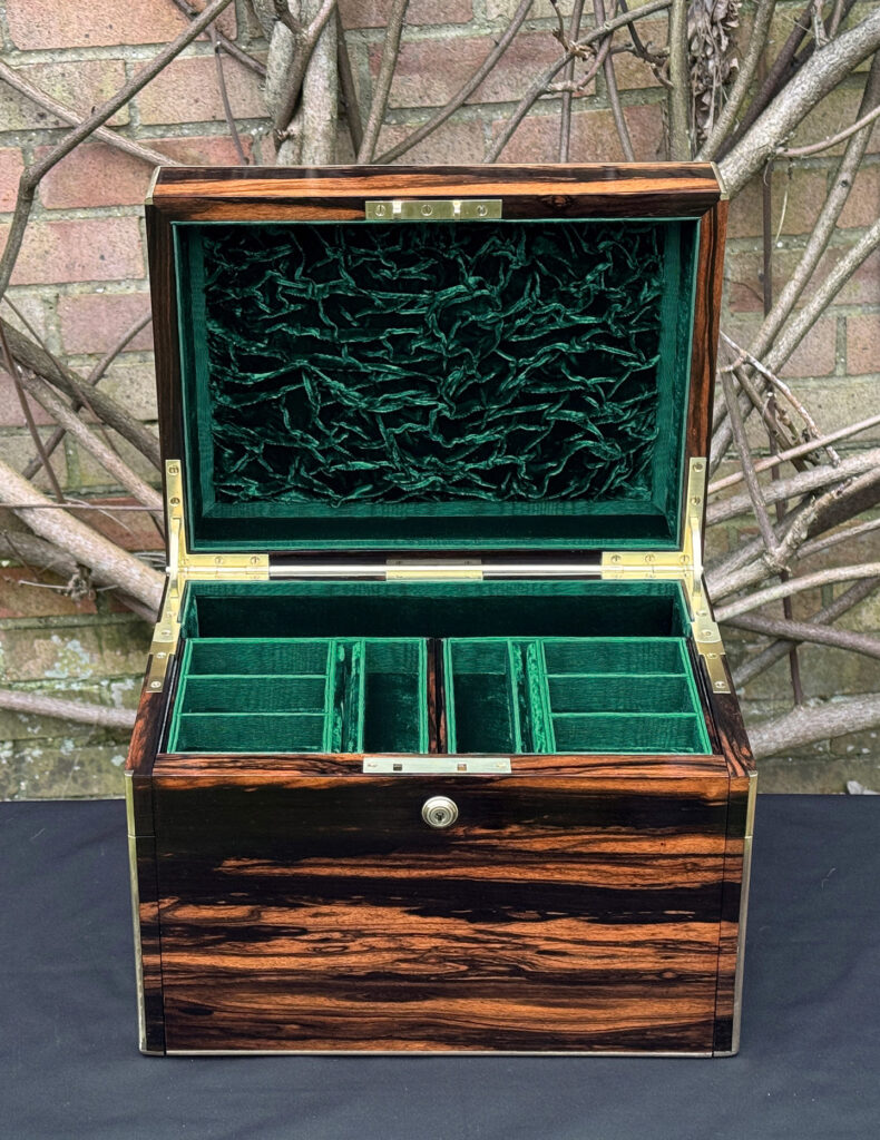Front interior view of an antique jewellery box in calamander - A wedding gift to the Duchess of St. Albans.