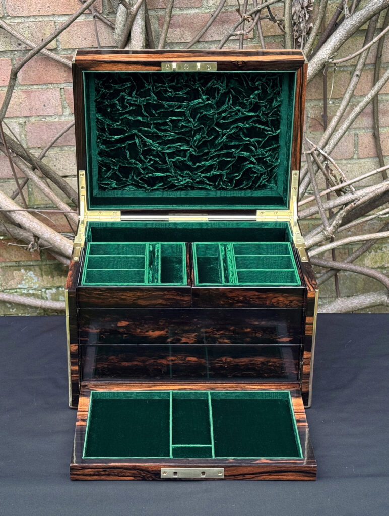 Front interior view of an antique jewellery box in calamander with flap lowered - A wedding gift to the Duchess of St. Albans.