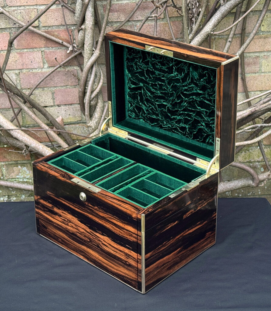 Front right interior view of an antique jewellery box in calamander - A wedding gift to the Duchess of St. Albans.