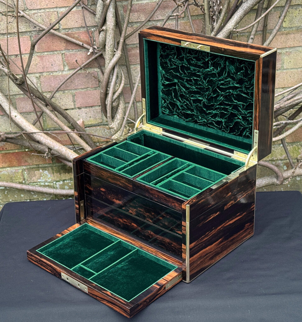 Front right interior view of an antique jewellery box in calamander with flap lowered - A wedding gift to the Duchess of St. Albans.
