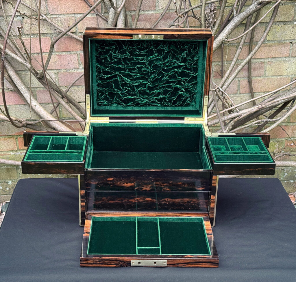 Front interior view of an antique jewellery box in calamander with trays fully opened - A wedding gift to the Duchess of St. Albans.