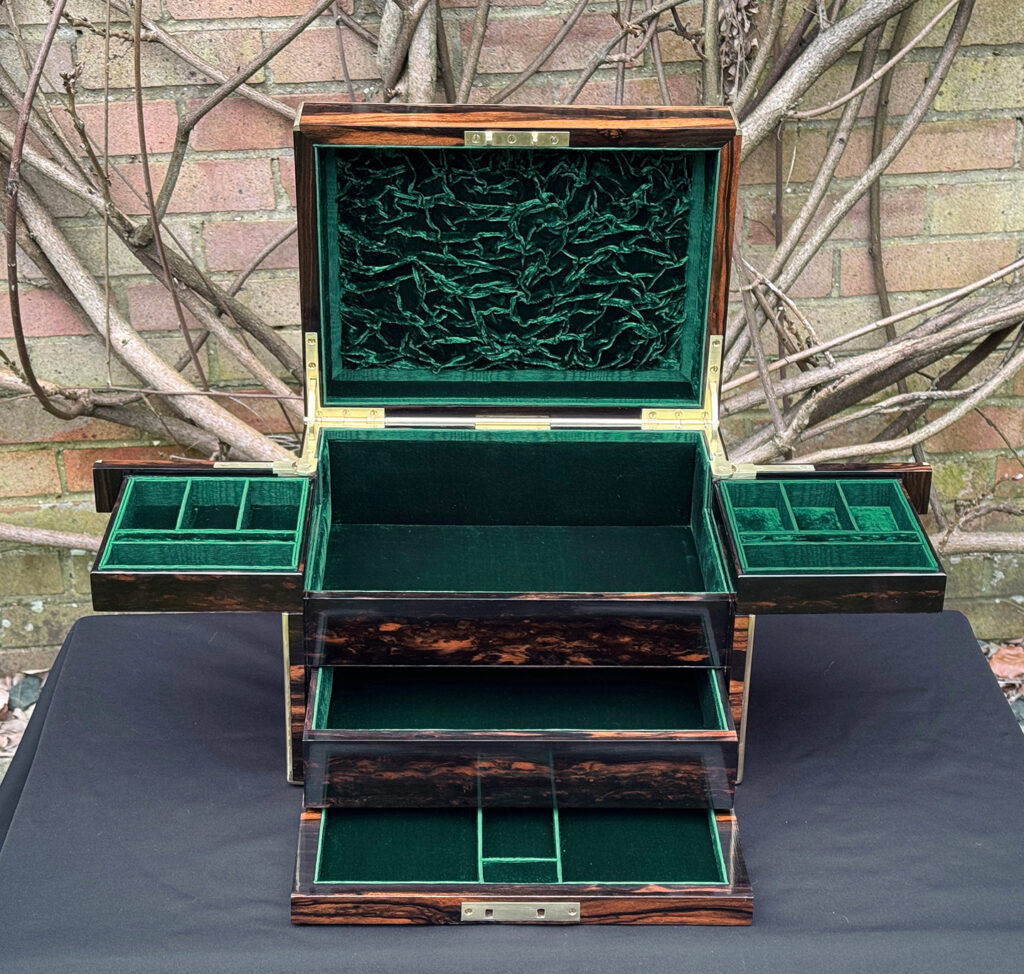 Front interior fully opened view of an antique jewellery box in calamander - A wedding gift to the Duchess of St. Albans.