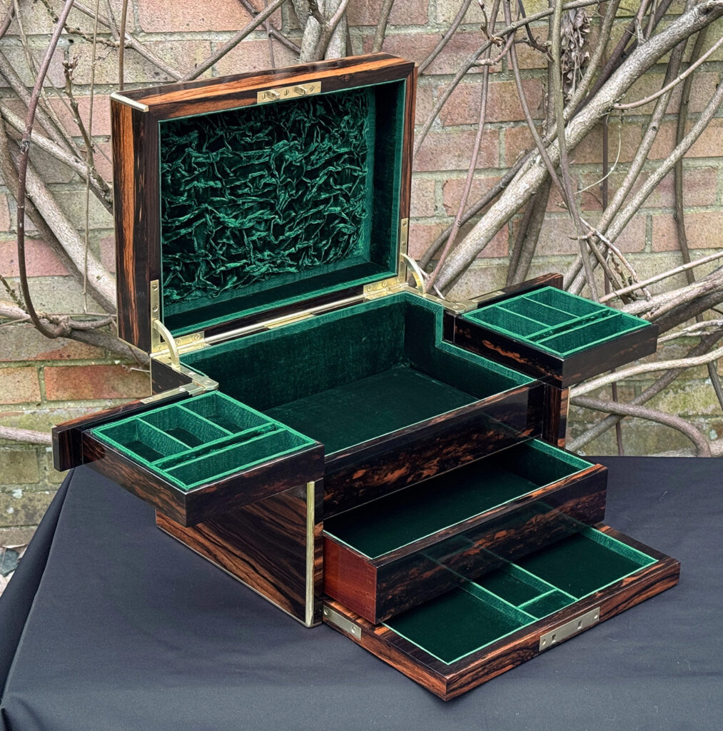 Front left interior fully opened view of an antique jewellery box in calamander - A wedding gift to the Duchess of St. Albans.