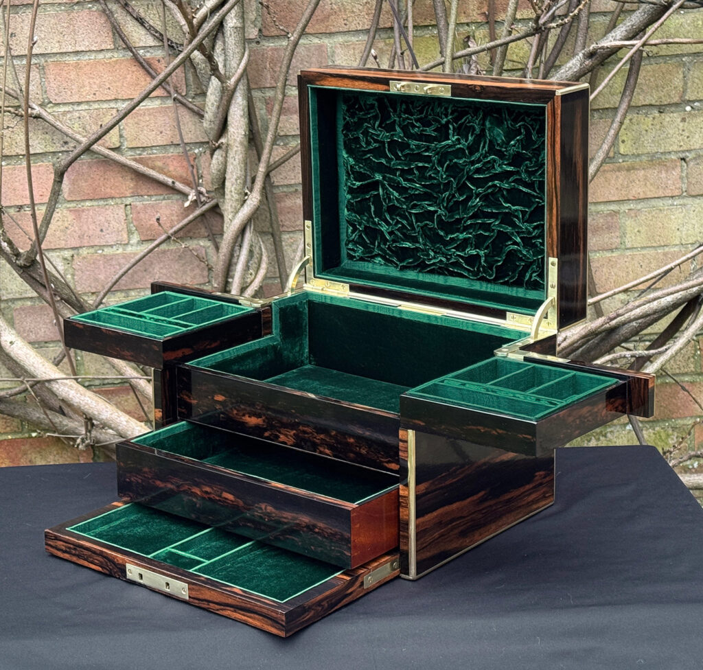 Front right interior fully opened view of an antique jewellery box in calamander - A wedding gift to the Duchess of St. Albans.