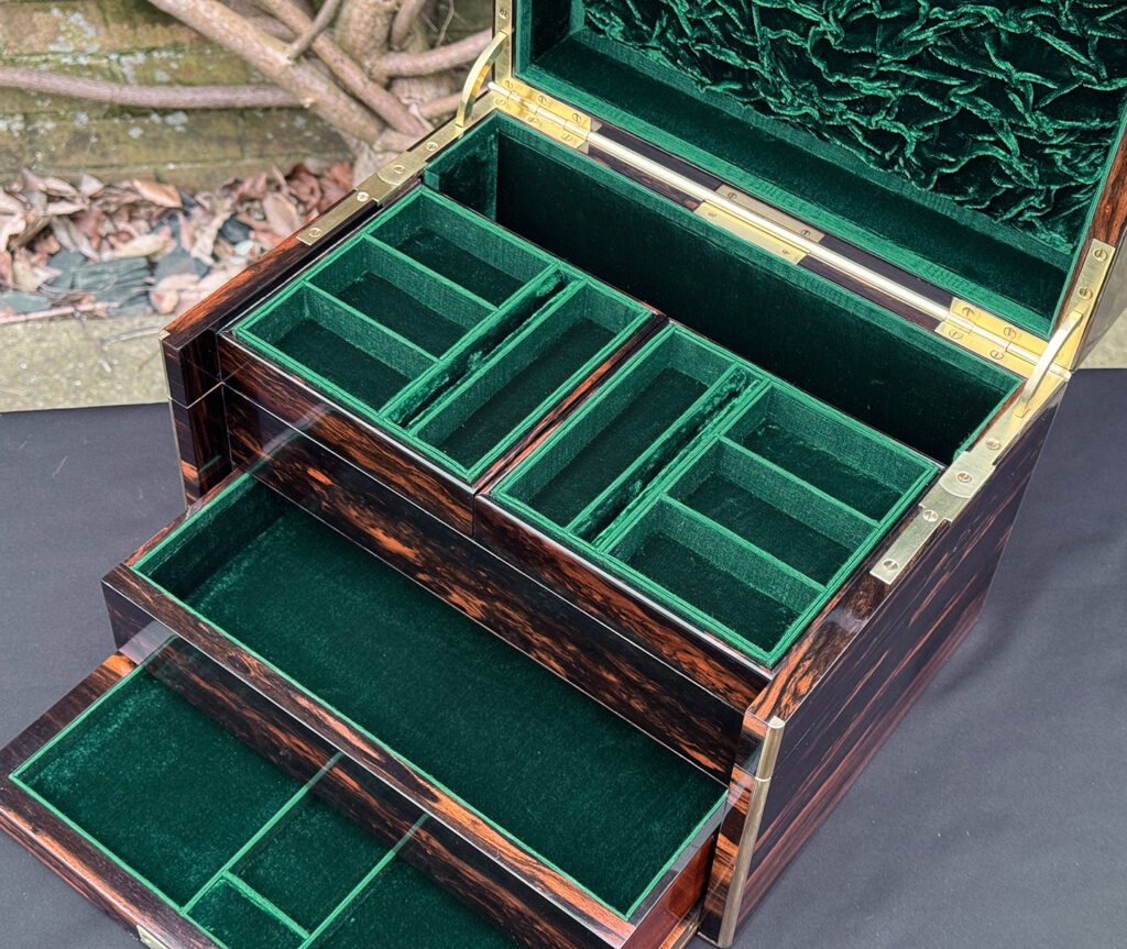 Overhead interior view of an antique jewellery box in calamander - A wedding gift to the Duchess of St. Albans.