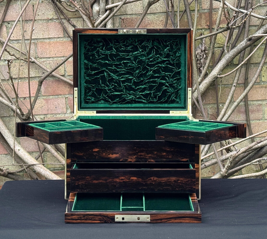Front interior view of an antique jewellery box in calamander - A wedding gift to the Duchess of St. Albans.
