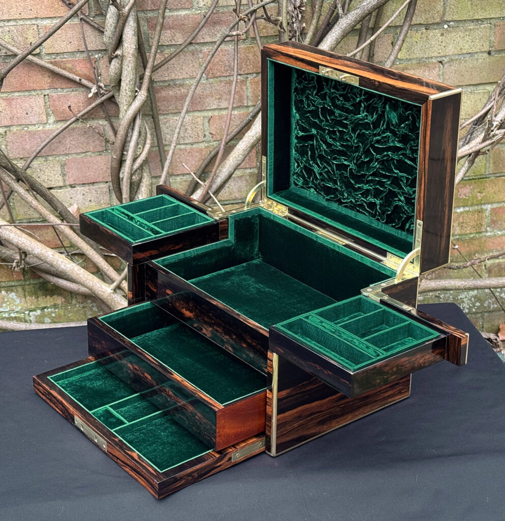 Front right interior view of an antique jewellery box in calamander - A wedding gift to the Duchess of St. Albans.