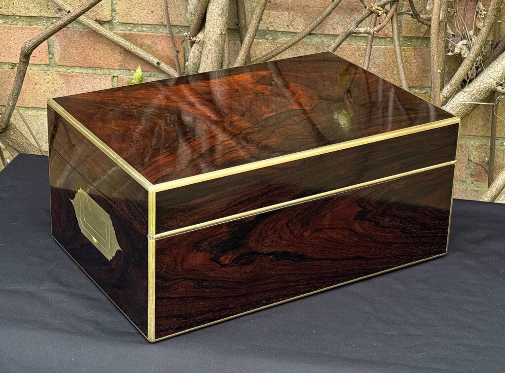 Rear right view of a large antique document & jewellery box in rosewood by Edwards.