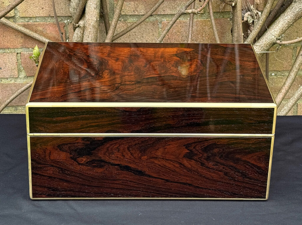 Rear view of a large antique document & jewellery box in rosewood by Edwards.