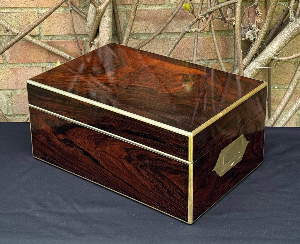 Rear left view of a large antique document & jewellery box in rosewood by Edwards.
