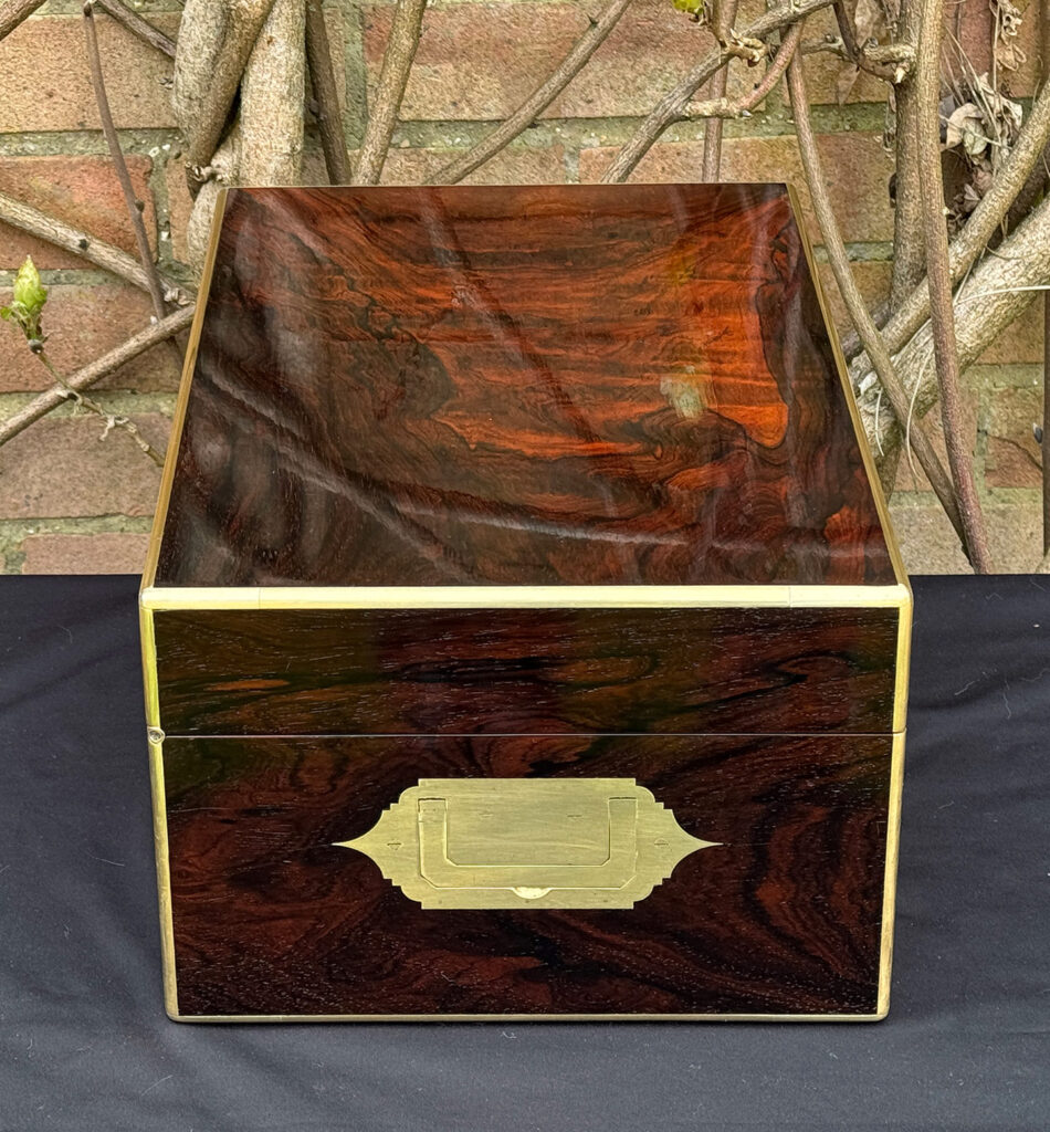 Left side view of a large antique document & jewellery box in rosewood by Edwards.