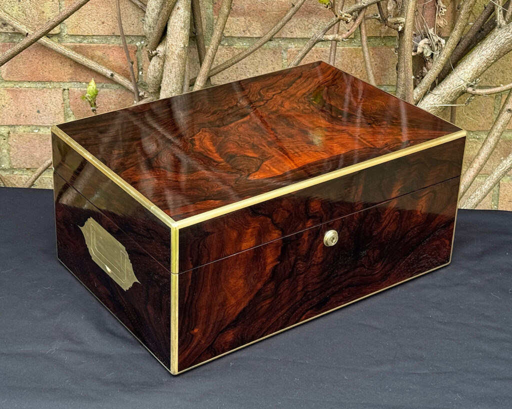 Front left view of a large antique document & jewellery box in rosewood by Edwards.