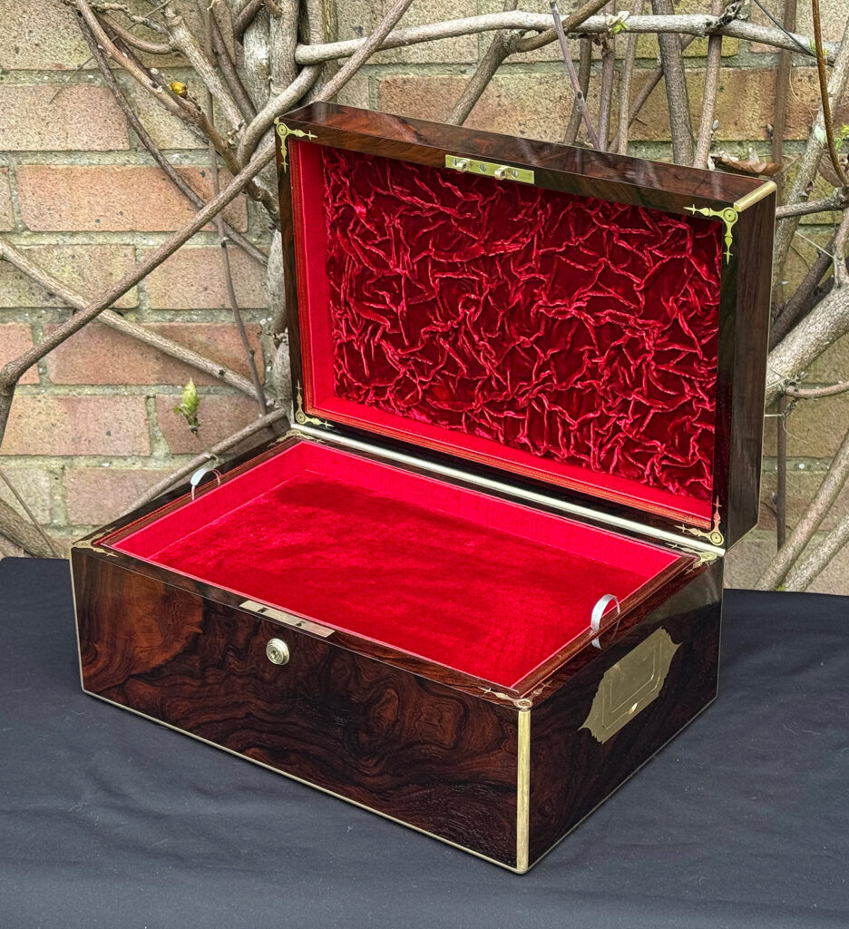 Front right interior view of a large antique document & jewellery box in rosewood by Edwards.