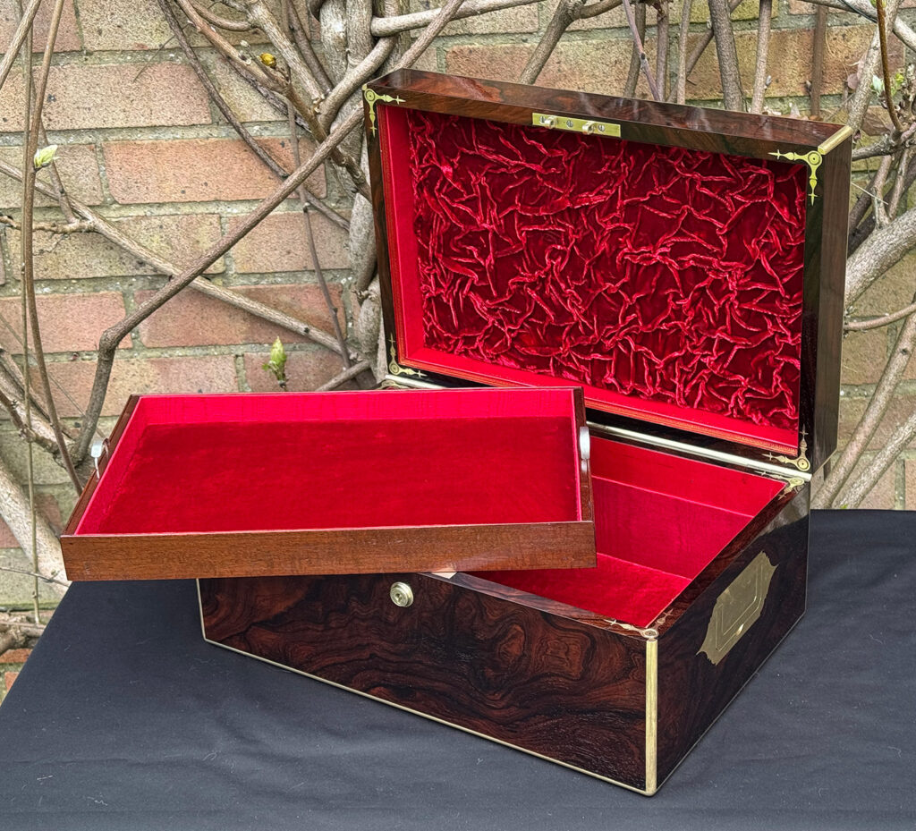 Front right interior view of a large antique document & jewellery box in rosewood by Edwards, with tray removed.