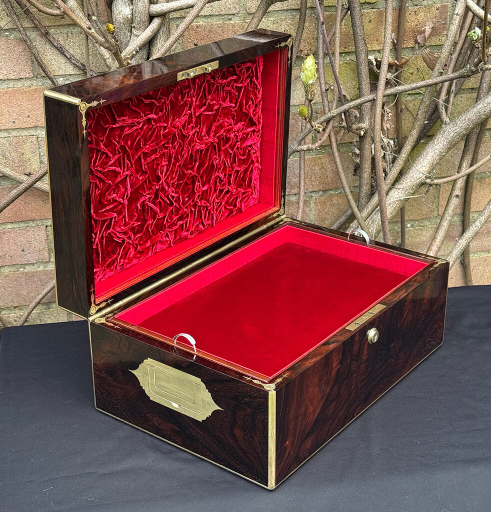 Left side interior view of a large antique document & jewellery box in rosewood by Edwards.