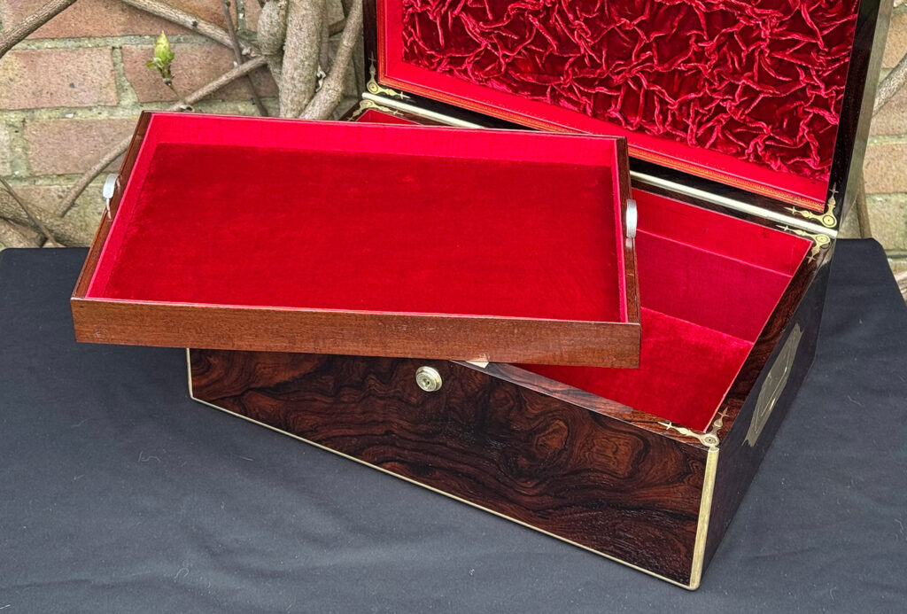 Closer interior view of a large antique document & jewellery box in rosewood by Edwards, with tray removed.