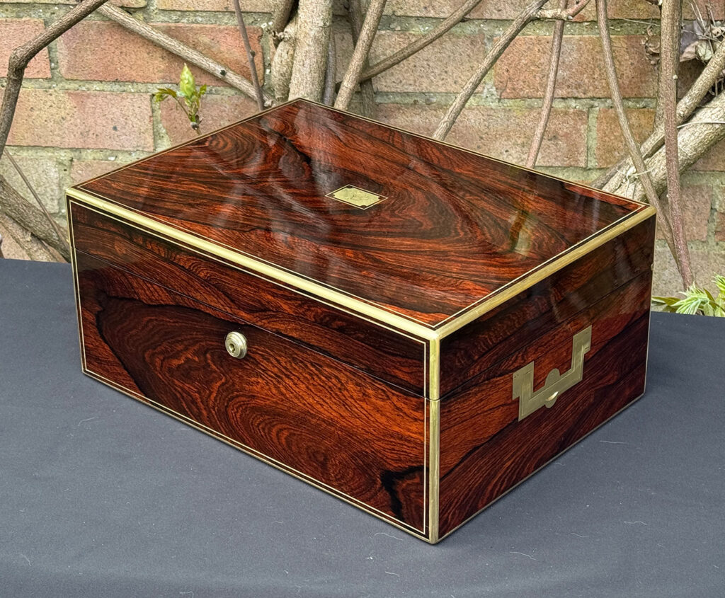 Front right view of an antique jewellery box in rosewood, by Edwards.