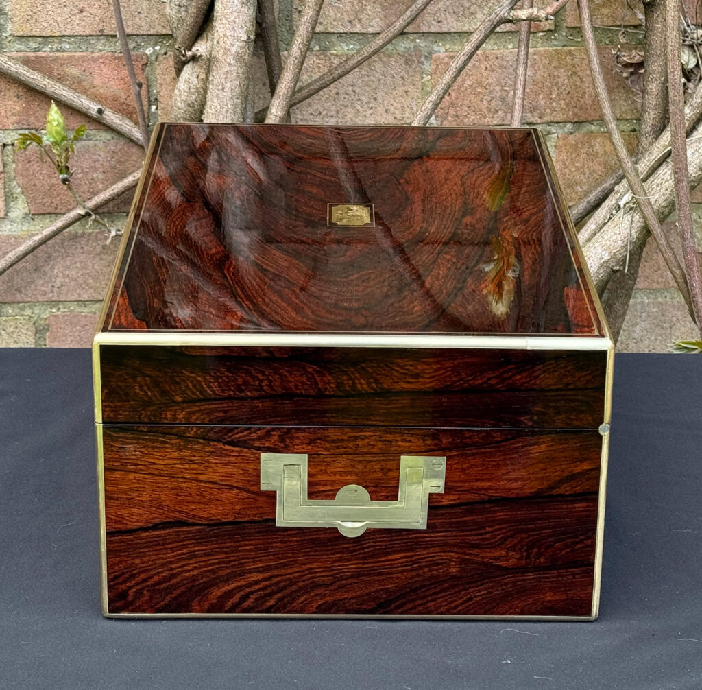 Right side view of an antique jewellery box in rosewood, by Edwards.
