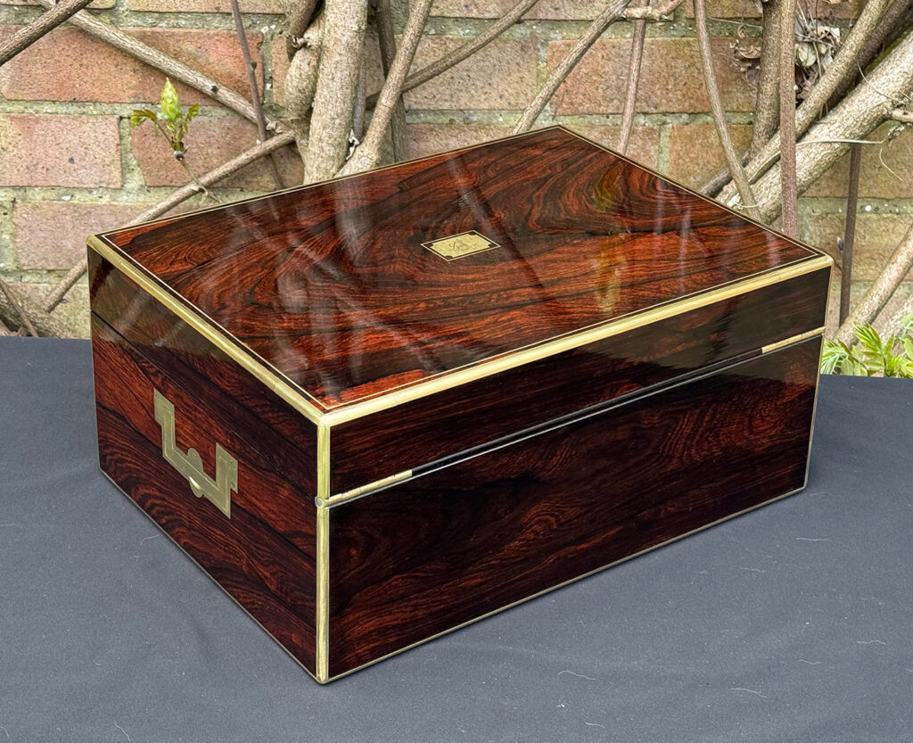 Rear right view of an antique jewellery box in rosewood, by Edwards.