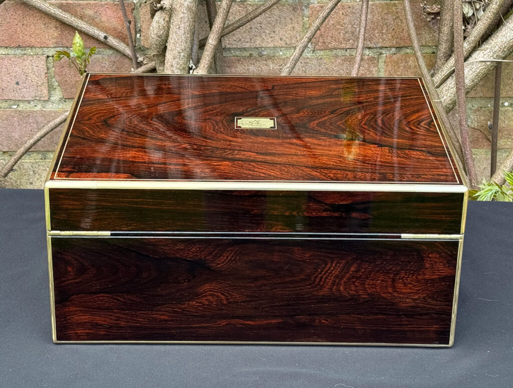 Rear view of an antique jewellery box in rosewood, by Edwards.