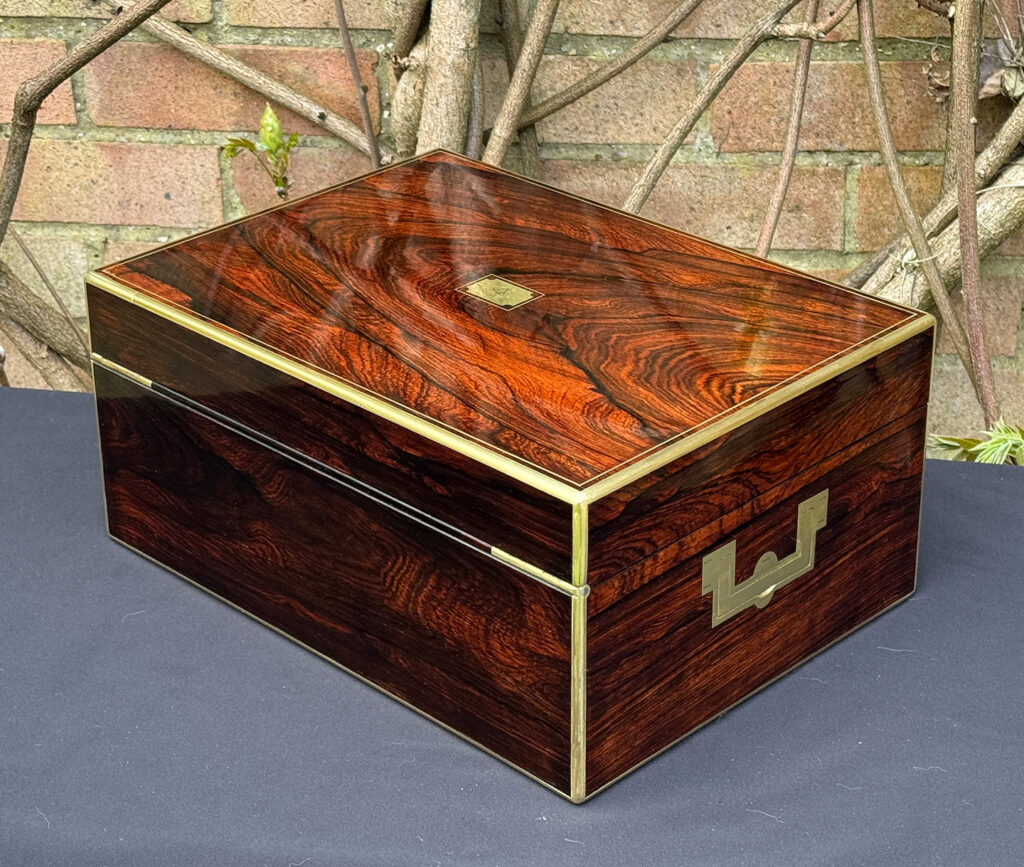 Rear left view of an antique jewellery box in rosewood, by Edwards.