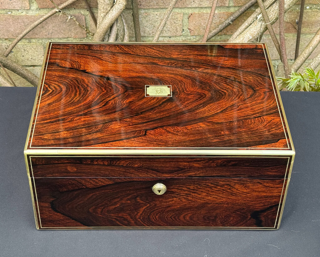 Overhead view of an antique jewellery box in rosewood, by Edwards.