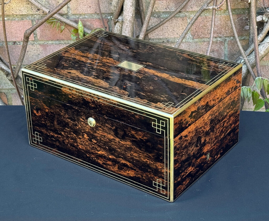 Front right view of an antique jewellery box in coromandel, by William Lund.