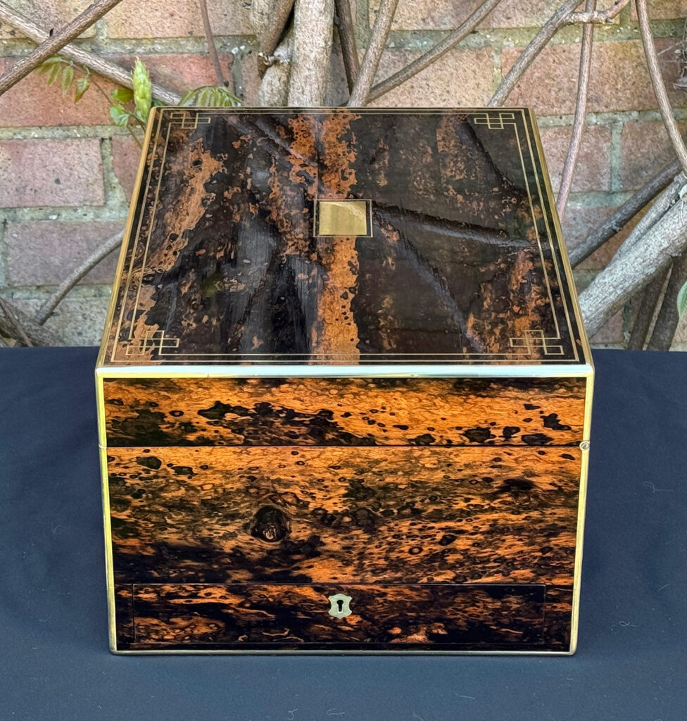 Right side view of an antique jewellery box in coromandel, by William Lund.