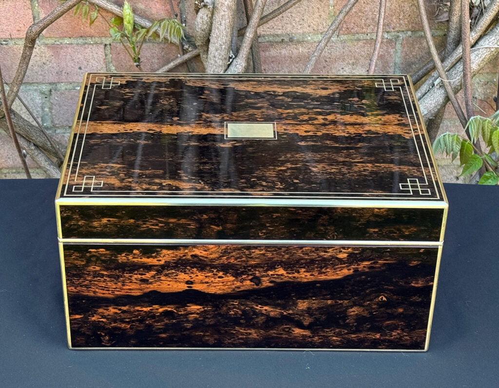 Rear view of an antique jewellery box in coromandel, by William Lund.