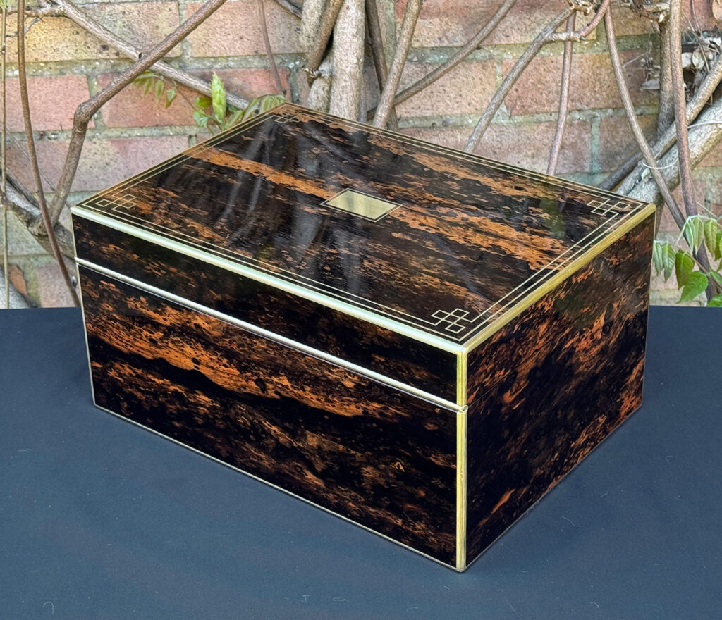 Rear left view of an antique jewellery box in coromandel, by William Lund.